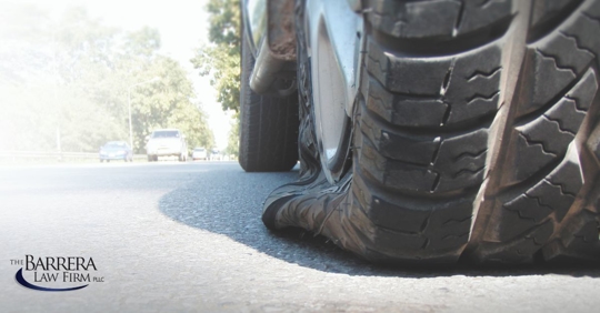 Flat tire on the side of the road